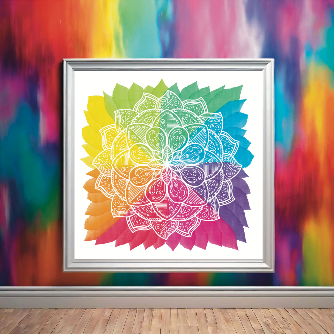 Abstract rainbow leaf pattern against a white backgroun, with white lotus mandala design drawn on top, framed and leaning against a rainbow wall